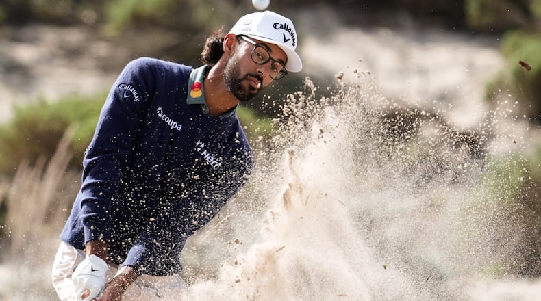Akshay Bhatia hits from a bunker toward the fourth fairway at Spyglass Hill Golf Course during the second round of the AT&T Pebble Beach Pro-Am golf tournament in Pebble Beach, Calif., Friday, Feb. 13, 2026. (AP Photo/Godofredo A. Vásquez)