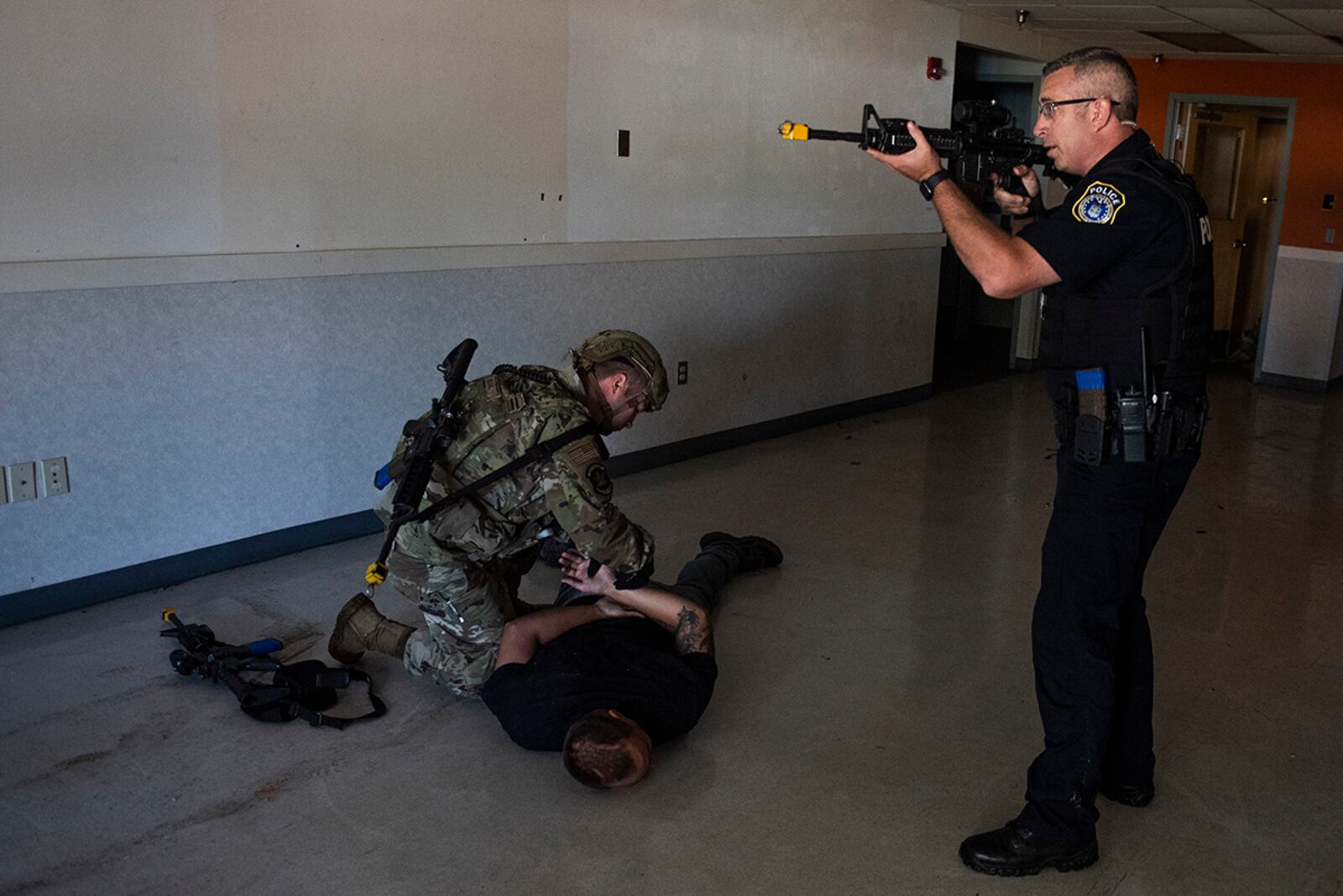Members of the 88th Security Forces Squadron take down the “active shooter” after locating and eliminating the threat during an exercise Aug. 18 at Wright-Patterson Air Force Base. U.S. AIR FORCE PHOTO/WESLEY FARNSWORTH
