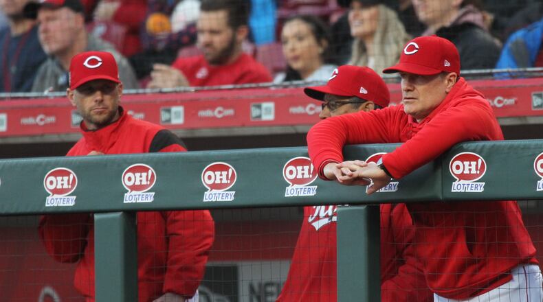 Reds manager David Bell, right, watches the action during a game against the Brewers on Tuesday, April 2, 2019, at Great American Ball Park in Cincinnati. David Jablonski/Staff
