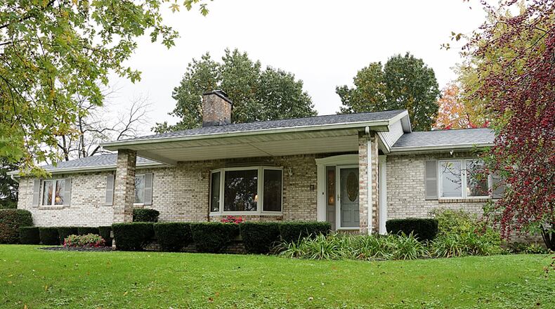 The brick ranch sits on 7.22 acres that includes a barn, fenced pasture, woods and a fenced back yard. The house has 4 bedrooms and a guest apartment that was once a 2-car garage bay. The apartment is complete with kitchenette, living room, bedroom and full bath. CONTRIBUTED PHOTO BY KATHY TYLER