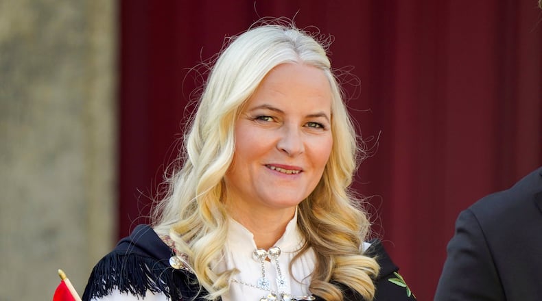 FILE - Norway's Crown Princess Mette-Marit watches a parade on the occasion of Norway's Constitution Day, at Skaugum, their official residence, near Oslo, Wednesday, May 17, 2023. (Lise Aserud/NTB Scanpix via AP, File)