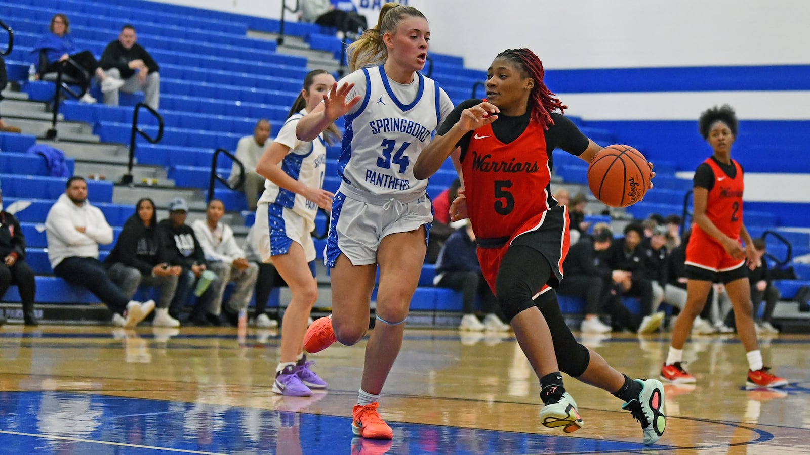 Wayne High School's Amaiya Quartman drives past Springboro's Ady Martin during their game on Wednesday, Jan. 7 at Springboro. JEFF GILBERT / CONTRIBUTED PHOTO