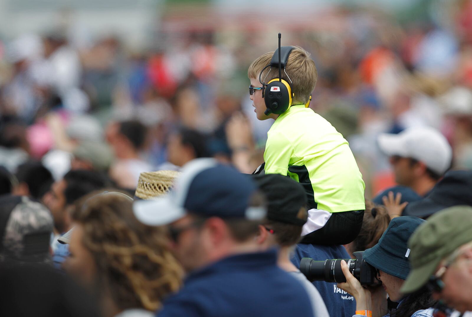 A young spectator got a lift on Saturday at the Vectren Dayton Air Show.   TY GREENLEES / STAFF