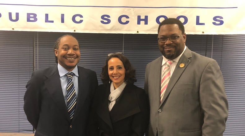 New Dayton school board members (from left) Will Smith, Gabriela Pickett and Dion Sampson were sworn in Tuesday, Jan. 14, 2020. JEREMY P. KELLEY / STAFF