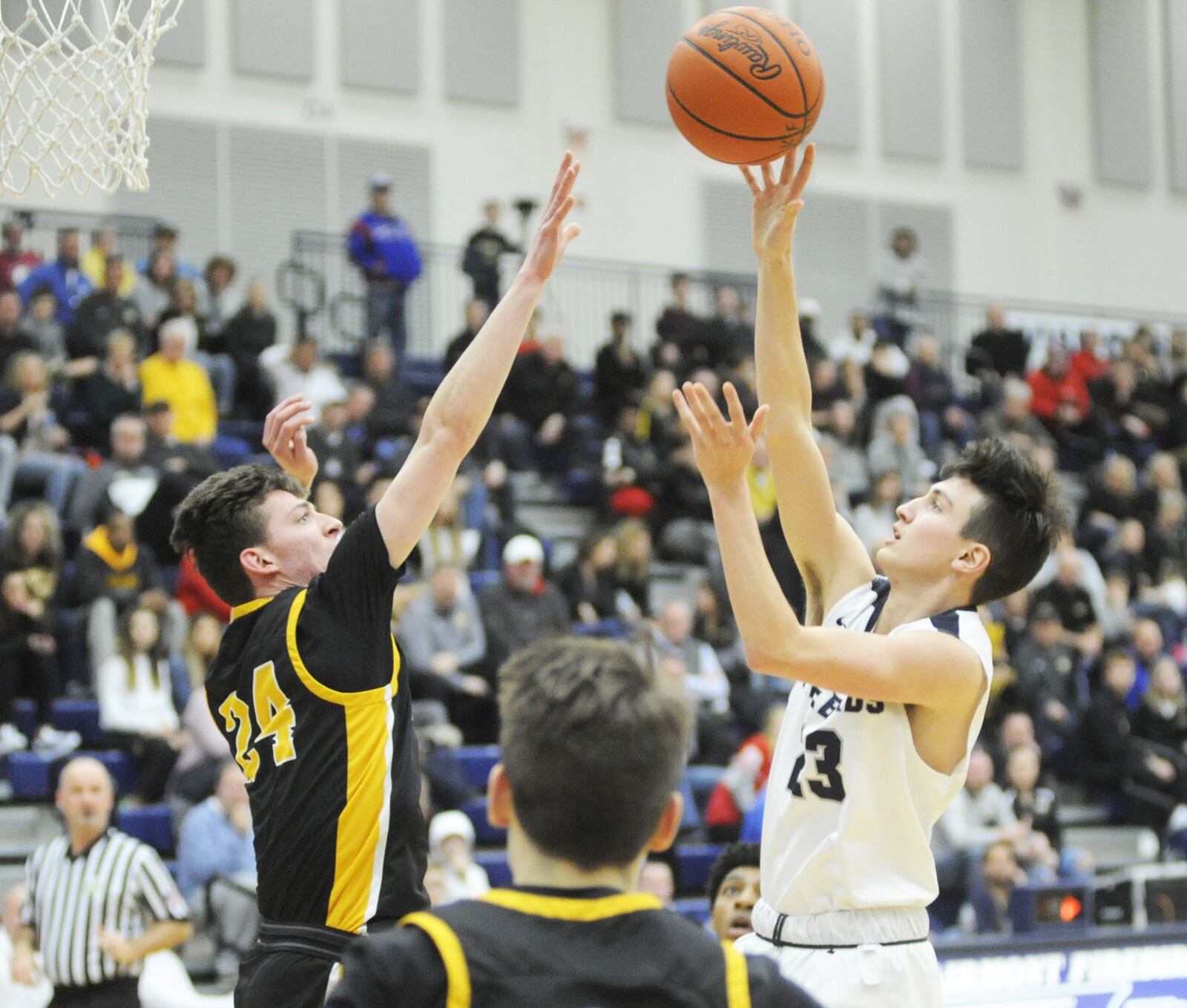 Kaleb Hall of Fairmont (right) gets off a shot over Davis Mumaw of Centerville. Centerville defeated Fairmont 46-44 in a boys high school basketball game at Trent Arena on Friday, Feb. 8, 2019. MARC PENDLETON / STAFF