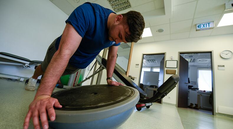 Senior Airman John Cabral, 52nd Security Forces member, performs a physical therapy exercise in the medical clinic at Spangdahlem Air Base, Germany, June 14. Providing an avenue for Airmen to rehabilitate on base helps 52nd Fighter Wing Airmen to maintain physical readiness to support worldwide Air Force operations. U.S. AIR FORCE PHOTO/STAFF SGT. CHANCE NARDONE