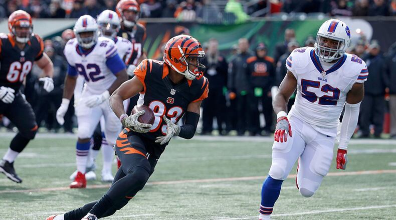 CINCINNATI, OH - NOVEMBER 20: Tyler Boyd #83 of the Cincinnati Bengals runs the ball past Preston Brown #52 of the Buffalo Bills during the first quarter at Paul Brown Stadium on November 20, 2016 in Cincinnati, Ohio. (Photo by Joe Robbins/Getty Images)