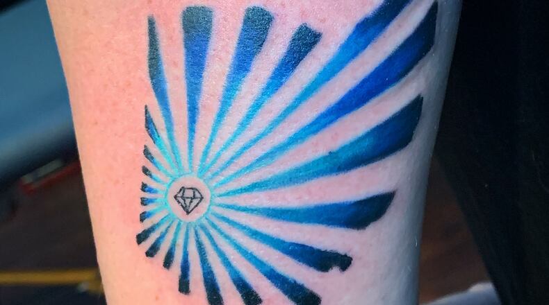 Since the Aug. 4 shooting in the Oregon District, local residents have flocked to local tattoo parlors to get some type of love note to Dayton. CONTRIBUTED