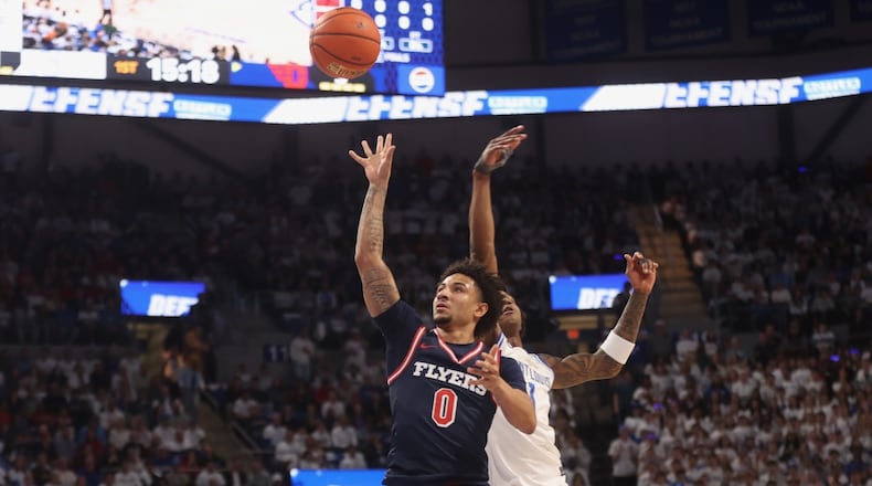 Dayton's Javon Bennett scores against Saint Louis on Friday, Jan. 30, 2026, at Chaifetz Arena in St. Louis, Mo. David Jablonski/Staff