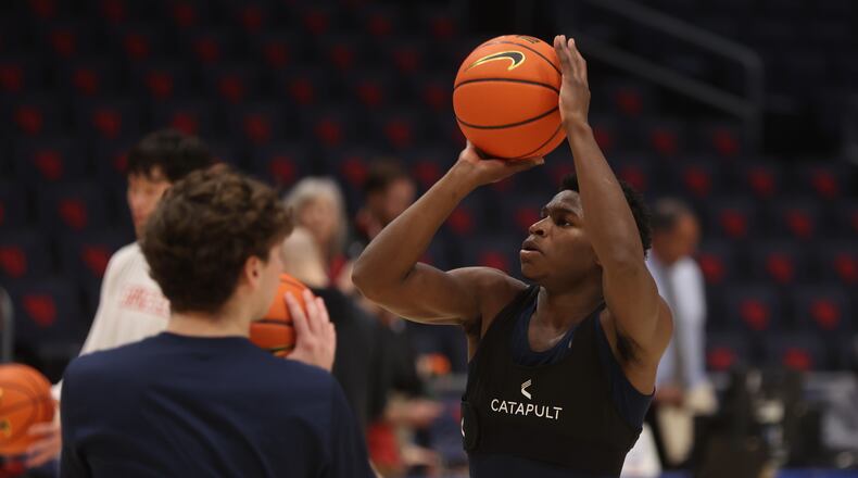 Dayton's Malachi Smith warms up before a game against Robert Morris on Saturday, Nov. 19, 2022, at UD Arena. David Jablonski/Staff