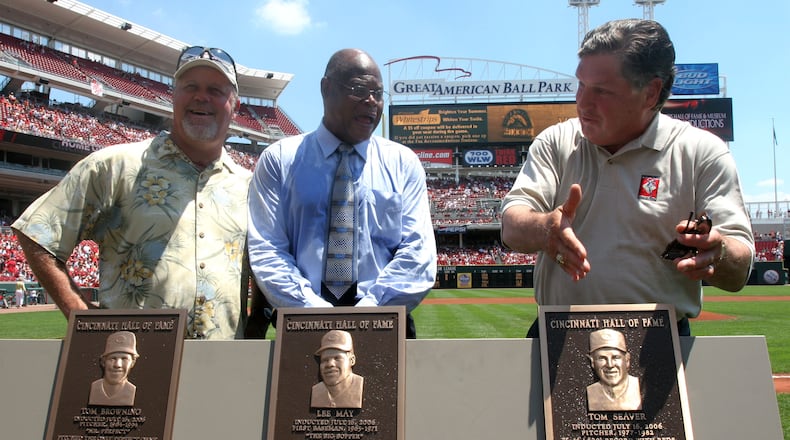 Former Cincinnati Reds players Tom Browning, Lee May and Tom Seaver, from left, stand next to their plaques during a ceremony inducting them into the Reds Hall of Fame before the baseball game against the Colorado Rockiesin Cincinnati Sunday, July 16, 2006.  (AP Photo/Tom Uhlman)