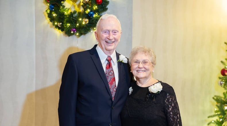 Ron, 90, and Faye, 88, Duncan posing for a photo at a Christmas celebration.