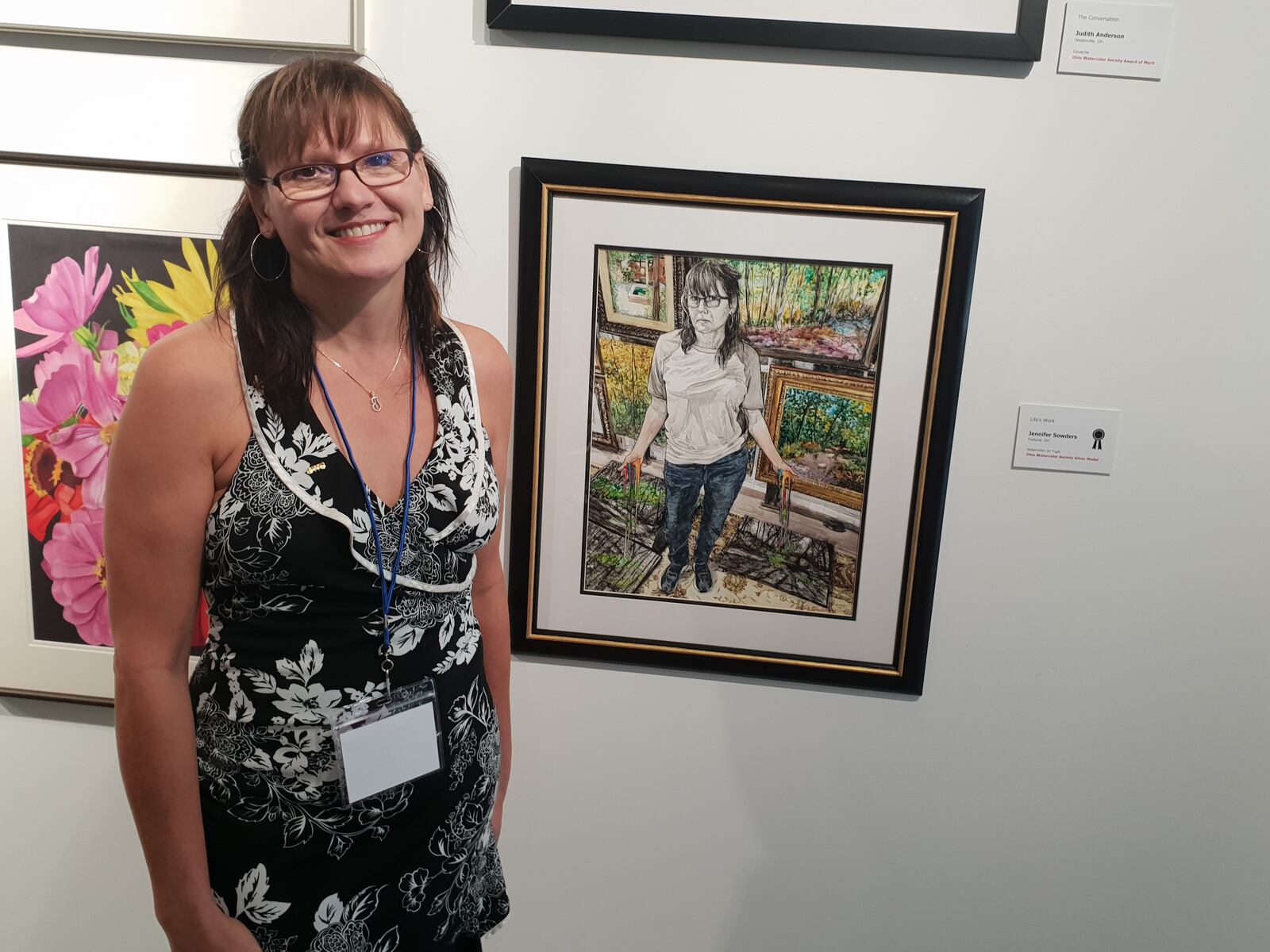 Jennifer Sowders posing next to her silver medal award-winning piece for a new exhibition that recently opened at the Springfield Museum of Art. CONTRIBUTED