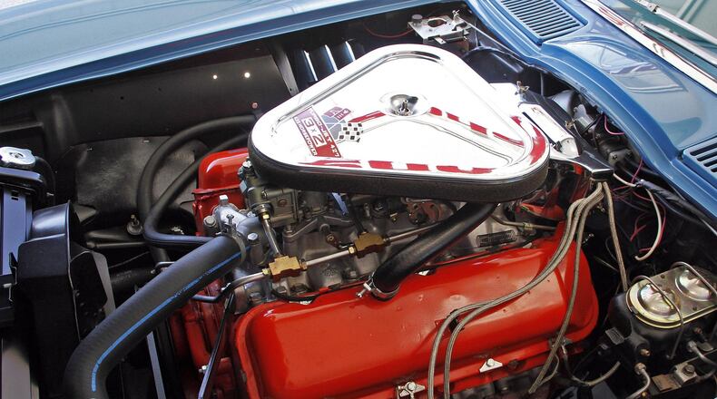 Highly detailed engine bay of a 1967 Corvette convertible which features this 427-cubic-inch, 435-horsepower V8 with 3 two-barrel carburetors at Mershon’s. © 2018 Photograph by Skip Peterson