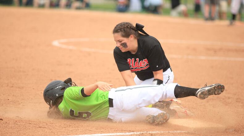 Greenvilleâs Megan Johnston is tagged out by Jonathan Alder third baseman Chloe Grove in a Division II regional final at Mason High School on Saturday, May 27, 2017. David Jablonski/Staff