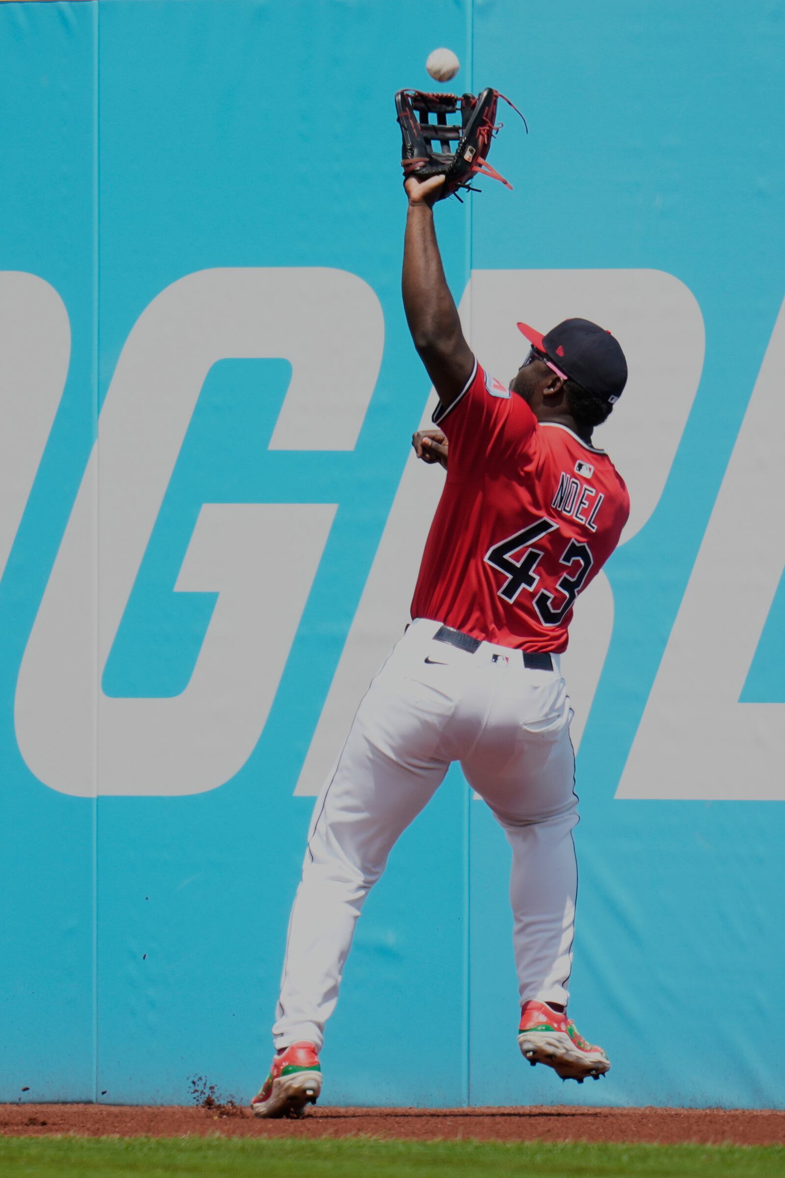 Cleveland Guardians right fielder Jhonkensy Noel (43) catches a fly ball hit for an out by Milwaukee Brewers' Caleb Durbin in the second inning of a baseball game in Cleveland, Wednesday, May 14, 2025. (AP Photo/Sue Ogrocki)