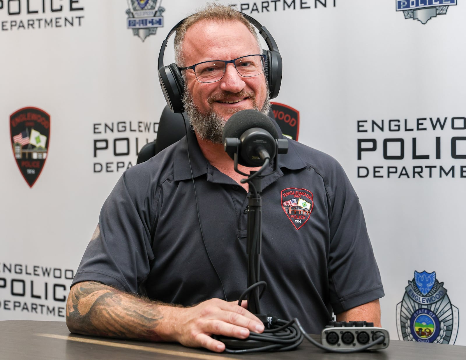 Englewood Police Department's Sgt. Eric Totel hosts podcast aimed at giving residents inside knowledge of what’s happening within their local police department. BRYANT BILLING / STAFF