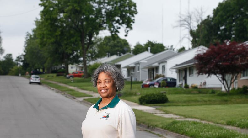 Lisa Parker Rucker, the former Pineview Neighborhood Association president, credits the Montgomery County Land Bank's Thriving Neighborhood Initiative with stabilizing the neighborhood by taking down several eyesores in the West Dayton community and renovating other homes. CHRIS STEWART / STAFF