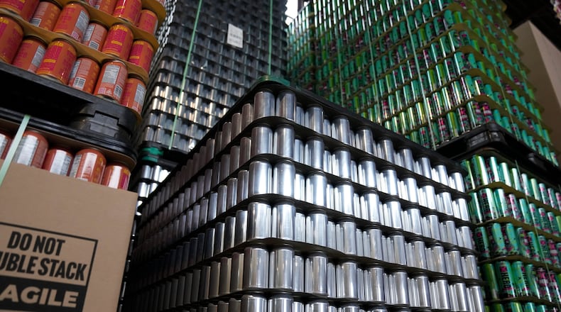 Empty aluminum cans are stacked at Revolution Brewing, Friday, Feb. 20, 2026, in Chicago. (AP Photo/Erin Hooley)