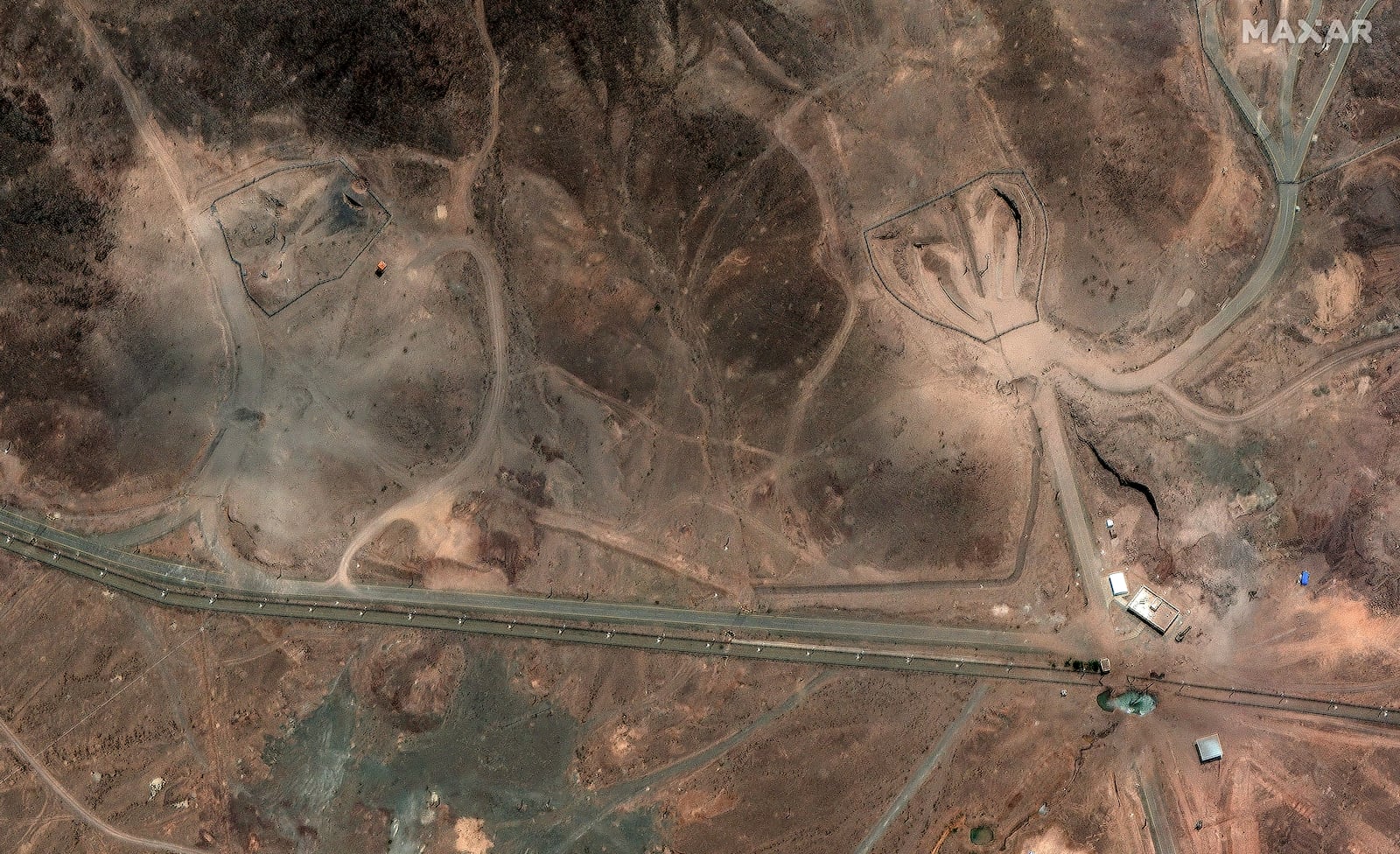 This Tuesday, June 24, 2025, satellite image provided by Maxar Technologies shows damage at Fordo enrichment facility after strikes in Iran on June 23. (Maxar Technologies via AP)