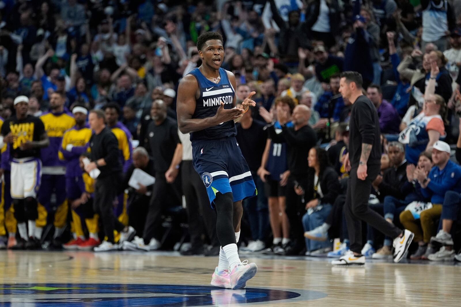 Minnesota Timberwolves guard Anthony Edwards (5) celebrates after making a 3-point shot during the second half of Game 4 of an NBA basketball first-round playoff series against the Los Angeles Lakers, Sunday, April 27, 2025, in Minneapolis. (AP Photo/Abbie Parr)