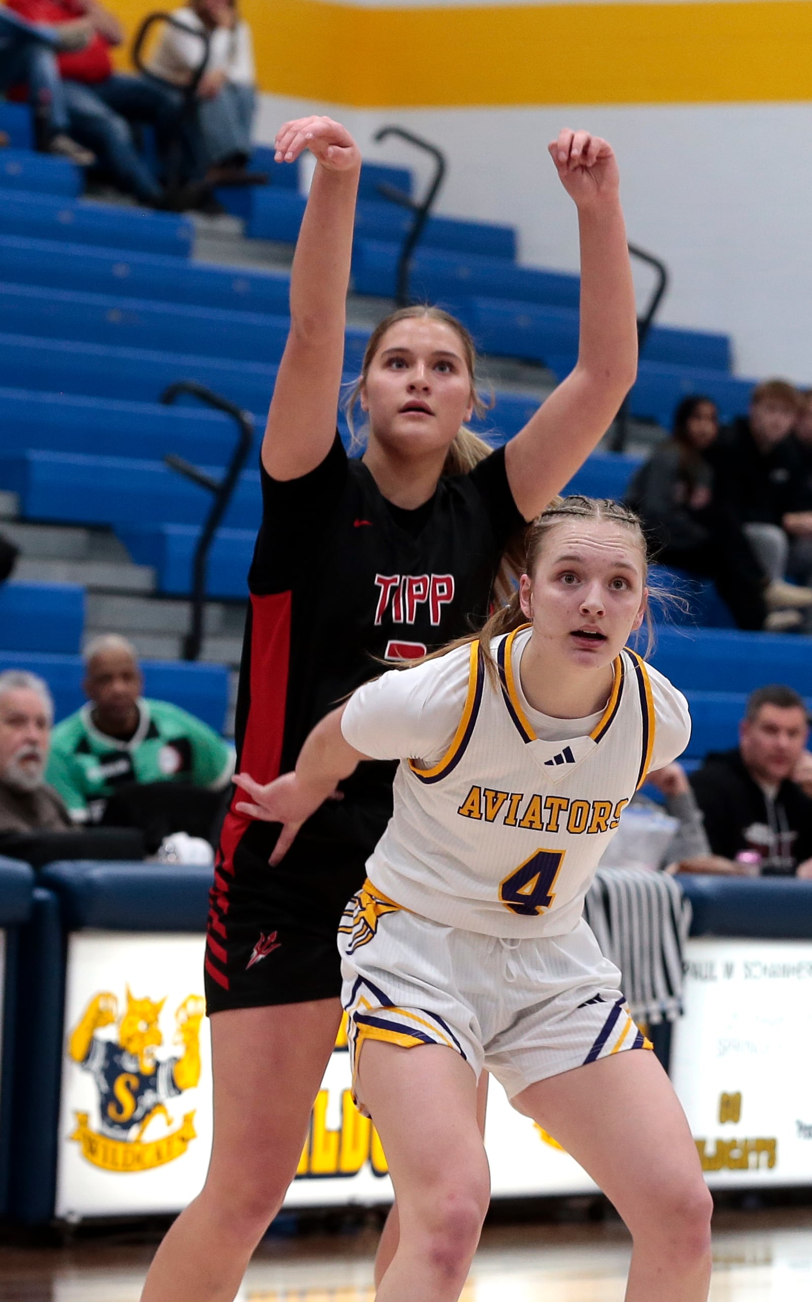 Tippecanoe sophomore Abbi Mader makes a three-pointer over as Butler freshman Alexa Moeller watches. Tippecanoe defeated Butler 49-32 in a Division III district semifinal on Wednesday, Feb. 25, 2026, in Springfield. STEVEN WRIGHT / STAFF