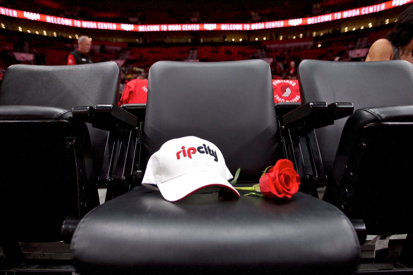 FILE - The seat for Trail Blazers owner Paul Allen has a rose and a hat placed on it before an NBA basketball game in Portland, Ore., Oct. 18, 2018. (AP Photo/Craig Mitchelldyer, file)