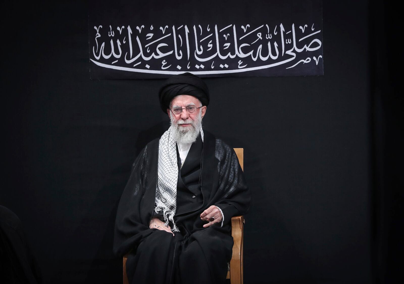 In this photo provided by the Office of the Iranian Supreme Leader, Supreme Leader Ayatollah Ali Khamenei attends a mourning ceremony commemorating the death anniversary of the Prophet Muhammad's grandson, Hussein, in Tehran, Iran, on Saturday, July 6, 2025. (Office of the Iranian Supreme Leader via AP)