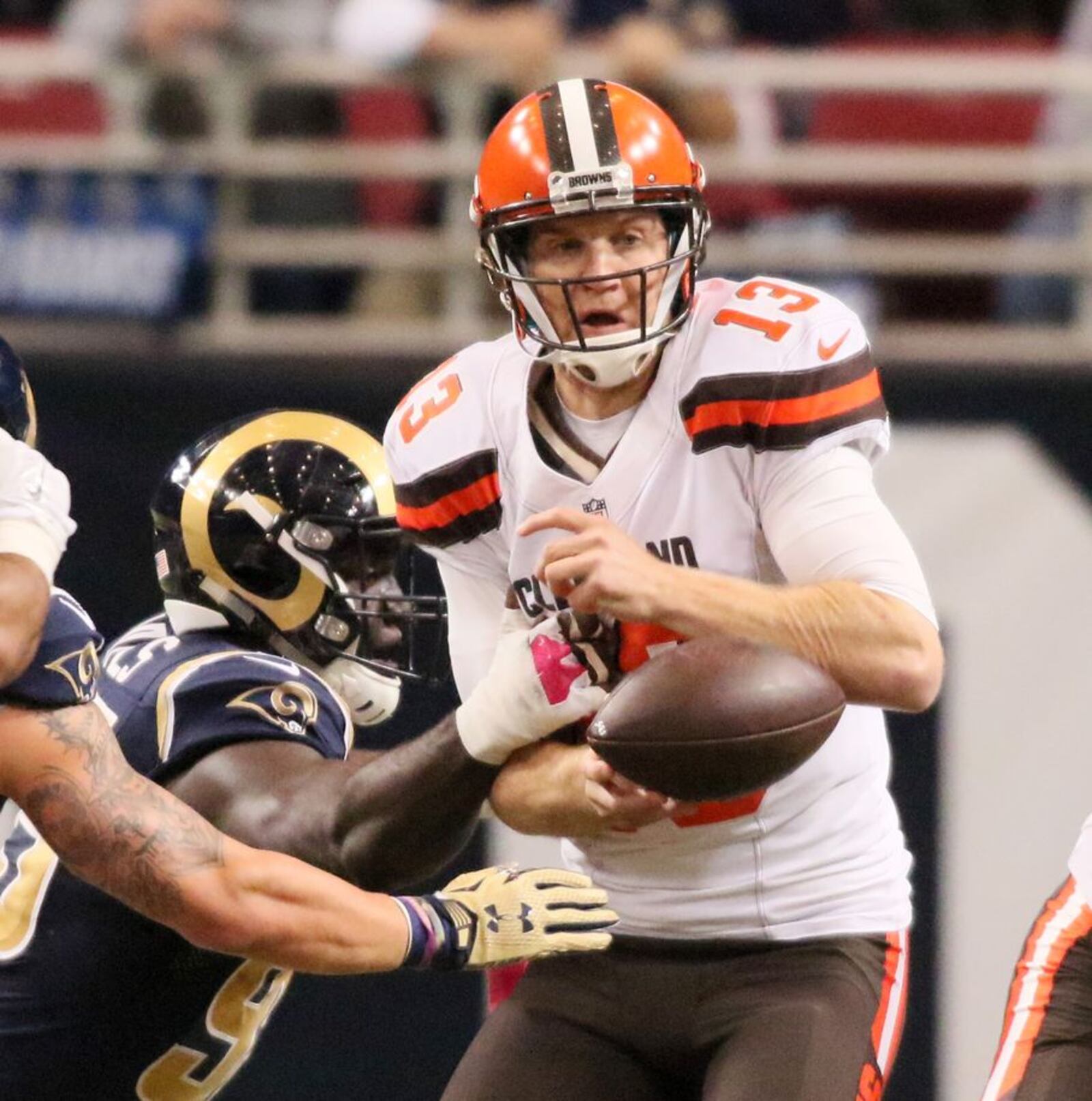 Cleveland Browns quarterback Josh McCown fumbles the ball as he is sacked by St. Louis Rams defensive end William Hayes, left, in the first quarter of an NFL football game on Sunday, Oct. 25, 2015, in St. Louis. The fumble was recovered by Rams linebacker Akeem Ayers. (Chris Lee/St. Louis Post-Dispatch via AP) EDWARDSVILLE INTELLIGENCER OUT, THE ALTON TELEGRAPH OUT