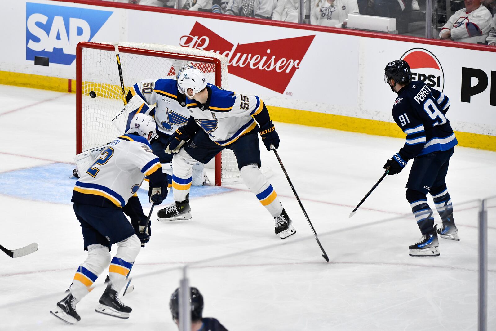 Winnipeg Jets' Cole Perfetti (91) scores against St. Louis Blues goaltender Jordan Binnington (50) during the second period of Game 7 in an NHL hockey first-round playoff series in Winnipeg, Manitoba, Sunday, May 4, 2025. (Fred Greenslade/The Canadian Press via AP)