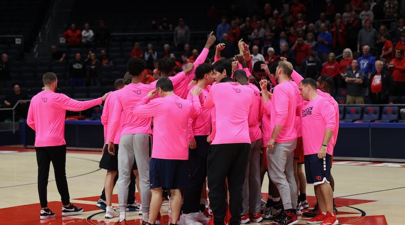 Dayton huddles before the Red & Blue Game on Saturday, Oct. 15, 2022, at UD Arena. David Jablonski/Staff