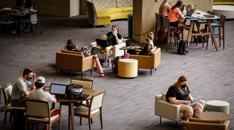 Wright State University students study in the library Wednesday August 25, 2021. Students are required to wear masks in campus buildings. JIM NOELKER/STAFF