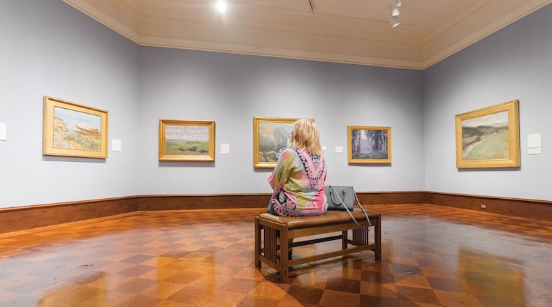 A guest ponders the artwork within the Dayton Art Institute. CONTRIBUTED