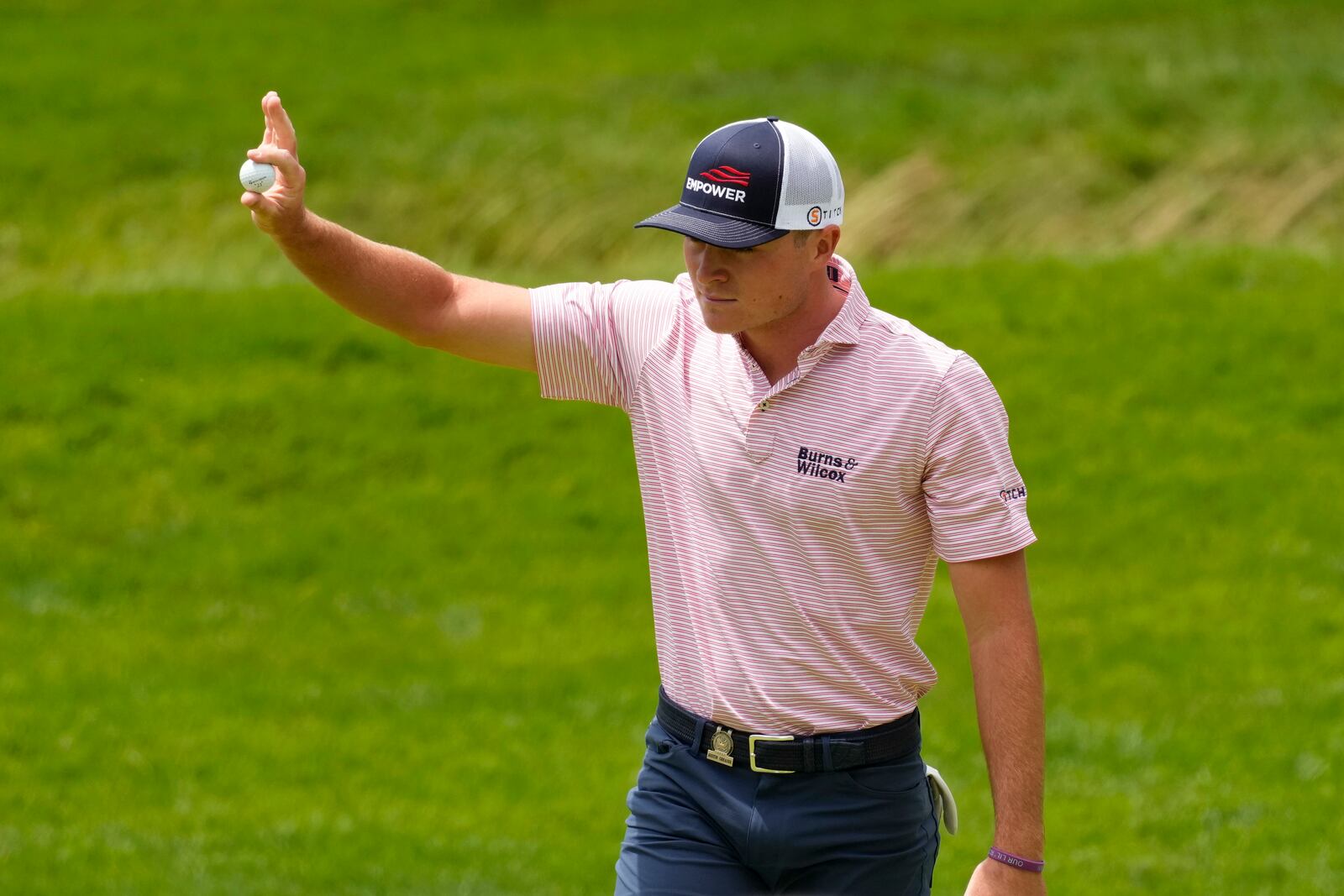 Austin Greaser reacts after a putt on the 12th hole during the first round of the U.S. Open golf tournament at The Country Club, Thursday, June 16, 2022, in Brookline, Mass. (AP Photo/Charlie Riedel)