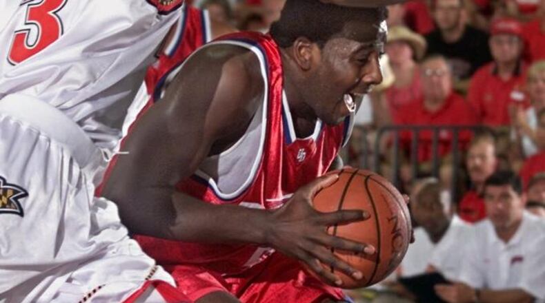 Dayton's Nate Green, right, is defended by Maryland's Juan Dixon after grabbing a rebound in the lane during the first half of the consolation game for third place in the Maui Invitational in Lahaina, Hawaii Wednesday, Nov. 22, 2000. (AP Photo/Michael Conroy)