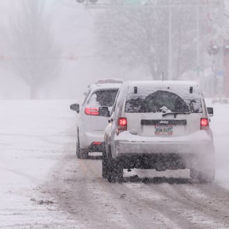 Several inches of snow fell around the Miami Valley on Dec. 13. Vehicles drive on East Main Street in Troy on Saturday, Dec. 13. BRYANT BILLING / STAFF