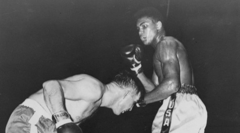 In this Oct. 29, 1960 photo, Cassius Clay, in white trunks is shown in his professional boxing debut, in Louisville’s Freedom Hall, against Tunney Hunsaker. The day before his star-studded funeral, members of Muhammad Ali’s Islamic faith will get their chance to say a traditional goodbye to the Champ. Bob Gunnell, a spokesman for Ali’s family, announced Monday that a Jenazah, a traditional Muslim funeral service, will be held at Freedom Hall at noon Thursday. (AP Photo/File)