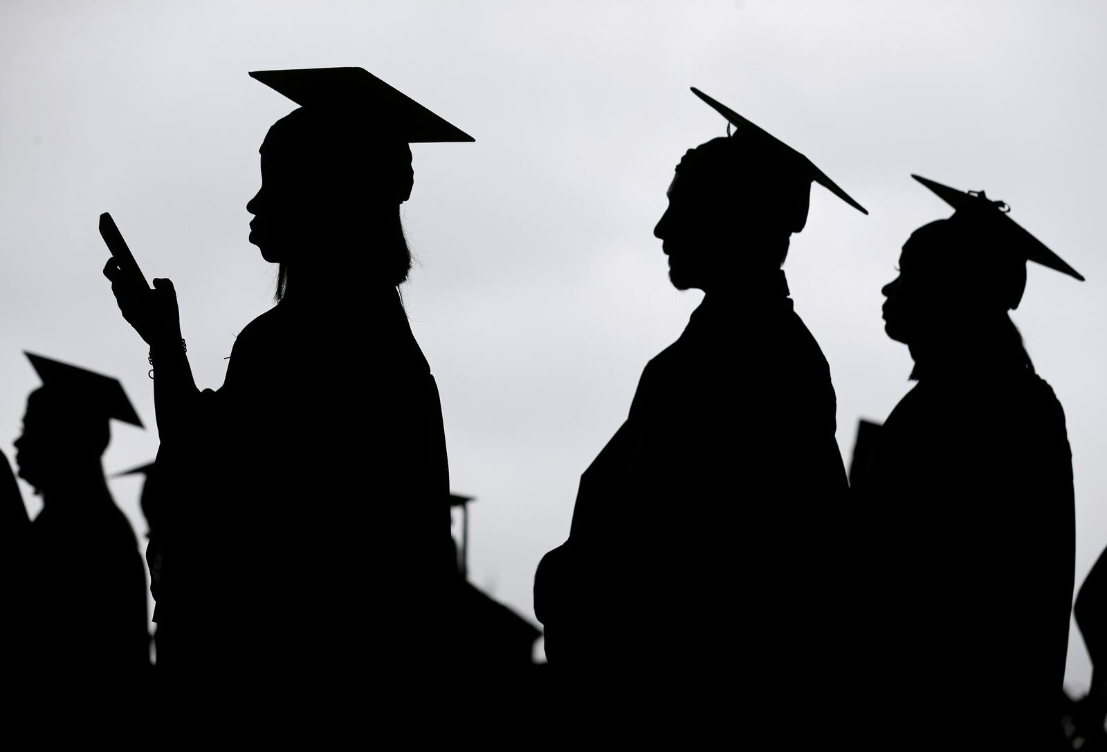 FILE - Graduates line up before the start of a community college commencement in East Rutherford, N.J., May 17, 2018. (AP Photo/Seth Wenig, File)