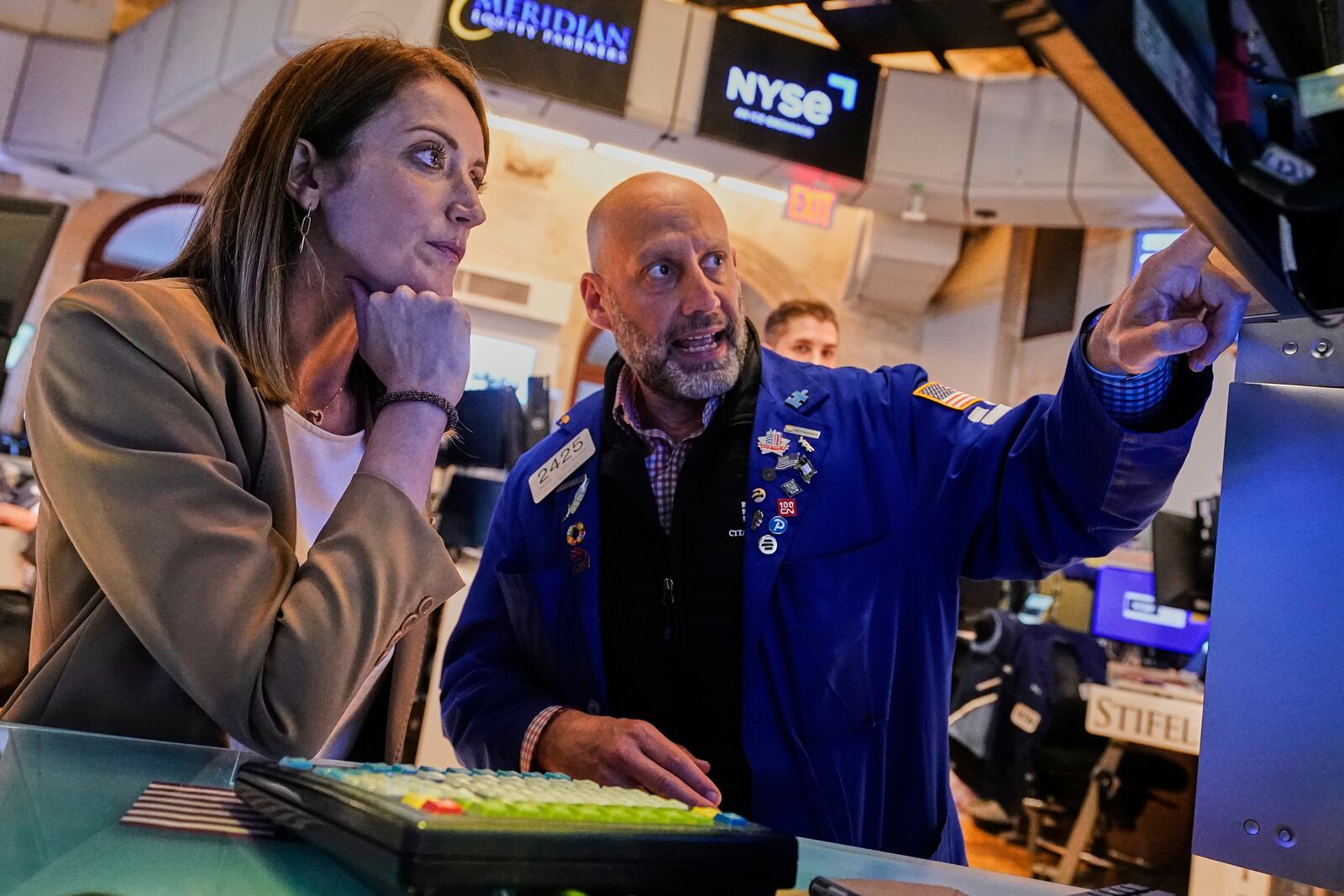 President of the European Parliament Roberta Metsola, from Malta, left, meets with specialist Meric Greenbaum during her visit to the trading floor of the New York Stock Exchange, Monday, June 9, 2025. (AP Photo/Richard Drew)
