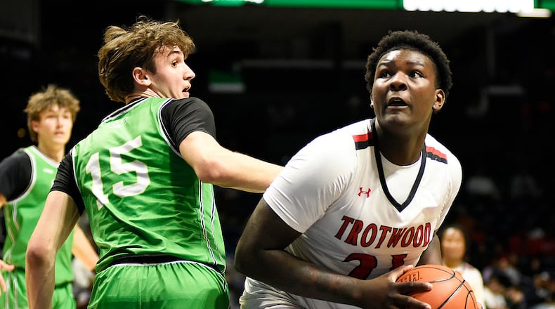 The Trotwood Madison boys basketball team beat Hamilton Badin 54-48 in the Division III, Region 12 championship game on Saturday, March 14, 2026, at Xavier University's Cintas Center. GEOFF NEVILLE / CONTRIBUTED PHOTO