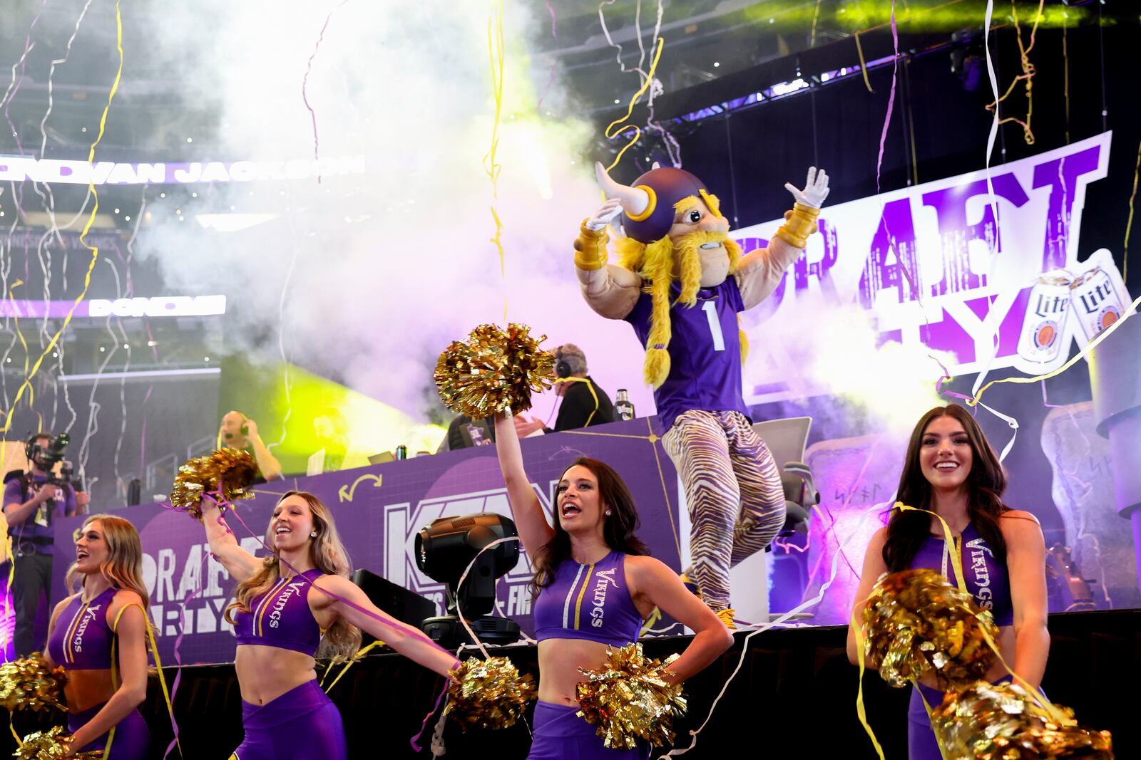 Minnesota Vikings cheerleaders and mascot celebrate after the team picked Ohio State offensive lineman Donovan Jackson at No. 24 in the first round during the Vikings NFL football draft party Thursday, April 24, 2025, in Minneapolis. (AP Photo/Ellen Schmidt)