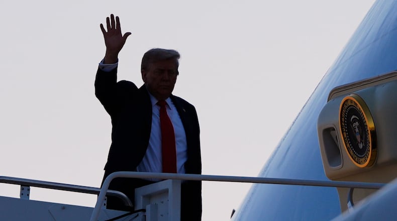 President Donald Trump waves as he boards Air Force One, Friday, Aug. 15, 2025, at Joint Base Andrews, Md. President Trump is traveling to a meeting with Russian President Vladimir Putin today in Alaska at a U.S. military base for a crucial summit. (AP Photo/Julia Demaree Nikhinson)