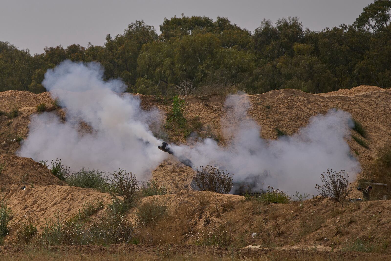 An Israeli mobile artillery unit fires a shell from southern Israel towards the Gaza Strip, in a position near the Israel-Gaza border on Tuesday, May 6, 2025. (AP Photo/Ohad Zwigenberg)