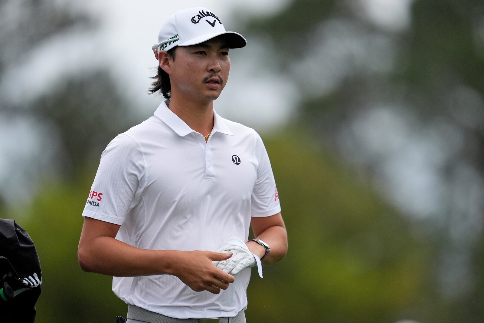 Min Woo Lee, of Australia, waits to hit from the 10th tee during a practice round at the Masters golf tournament, Monday, April 7, 2025, in Augusta, Ga. (AP Photo/George Walker IV)