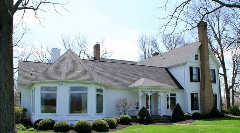 Two side porches echo the style of the Victorian front porch. Outbuildings include a barn with a party loft. Stalls and multiple storage spaces are on the barn’s lower level. There are raised vegetable and flower beds in the back yard along with a work/storage shed and a recently added dog house and enclosed run.