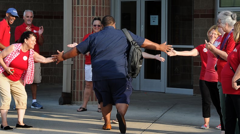 The Dayton teachers union members clap in first year teachers Thursday, Aug. 3, 2023 at Thurgood Marshall High School. MARSHALL GORBY\STAFF