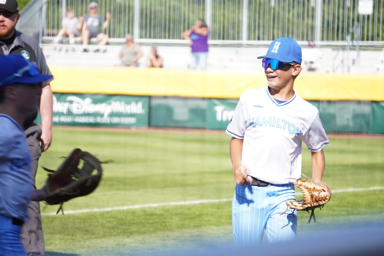 West Side Little League's Lennox Brown jogs in from right field with a smile after making an inning-ending catch during his Great Lakes Region game against Michigan on Sunday at the Little League Central Region Complex in Whitestown, Indiana. West Side won 8-0. CHRIS VOGT / CONTRIBUTED