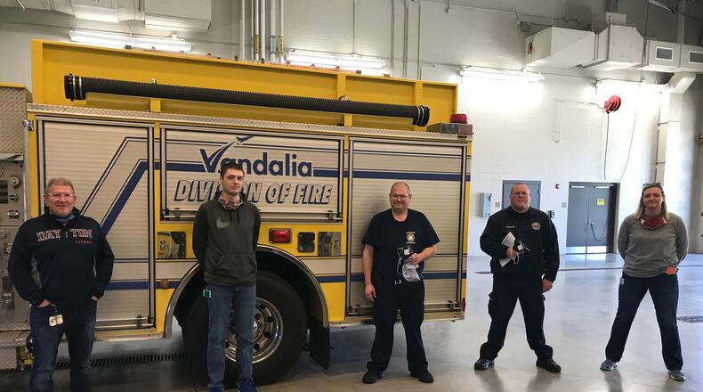 Vandalia fire fighters with the 3D-printed equipment from Inveta. CONTRIBUTED