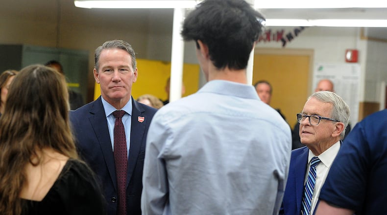Ohio Lt. Gov. Jon Husted, left and Ohio Gov. Mike DeWine, talked with students and staff at Kettering Fairmont High School Friday, Nov. 3, 2023. Gov. DeWine announced that Kettering will receive $2.8 million to renovate and add space to the current mechanical engineering lab. MARSHALL GORBY\STAFF