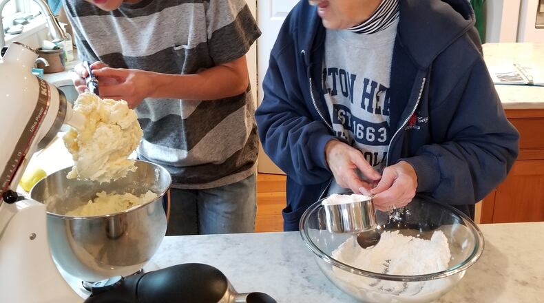 Nathan Hess baking with his grandmother, Sylvia Hess.